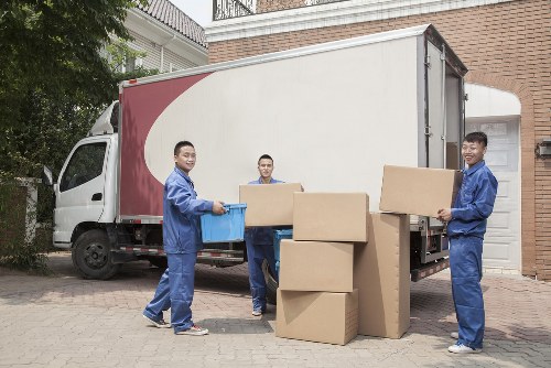 Professional movers reviewing health and safety standards on site