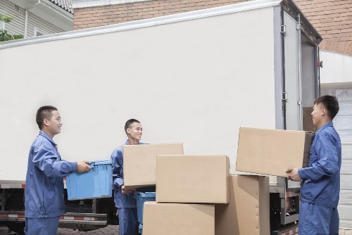 Furniture pick-up team preparing a collection in a Pimlico residential street