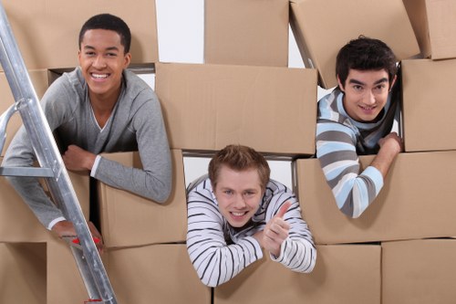Professional movers handling belongings in a Pimlico property