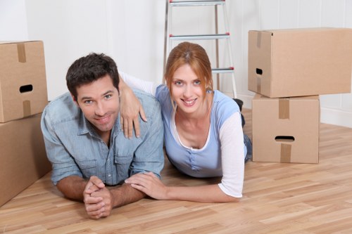 Professional movers loading items into a van for a central London removal