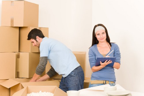 Professional removalists unloading boxes at a new home